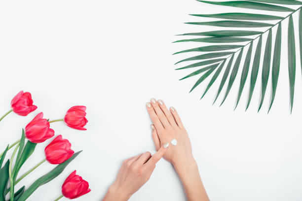 istock Female's hands put cosmetic cream 1129113542