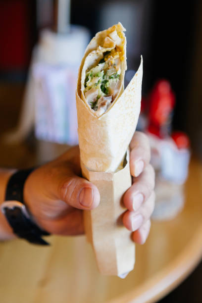 istock Chicken roll ready to eat in a hand 1129116216