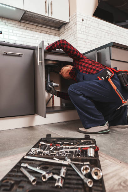 istock All tools just in case. Seniour handyman repairing washbasin at the kitchen 1129117189