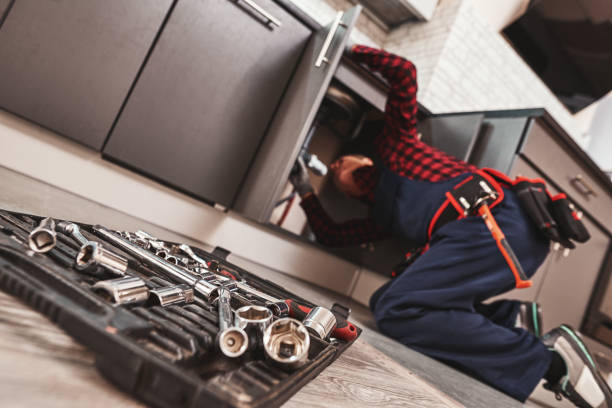 istock All tools just in case. Seniour handyman repairing washbasin at the kitchen 1129117193