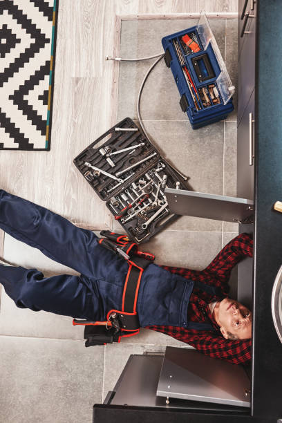 istock Tools case. Top view of seniour handyman repairing washbasin 1129117227