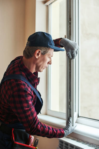 istock Quality skills. Side view of senior handyman setting new windows 1129117321