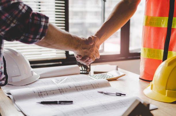 istock construction worker team hands shaking after consultation meeting to greeting start up plan new project contract in office center at construction site, teamwork, partnership and contractor concept 1129117742