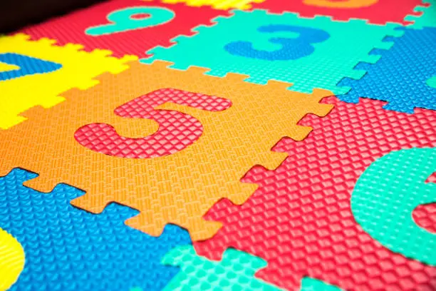 Colorful Baby Mat. Rubber foam pad for children playing. Colorful background ackground with digits