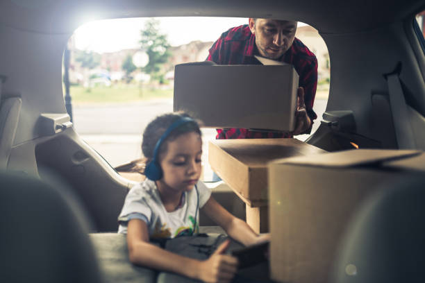 istock I will stay entertained while my father is taking care of the boxes 1129120145