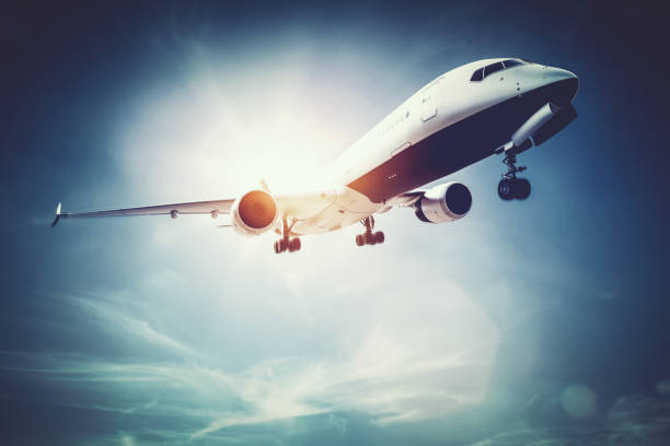istock Airplane flying on the sunny sky. 1129121002