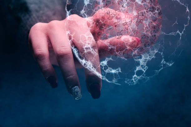 istock Human forefinger touches cell dividing and atom. Mixed media. 1129121005