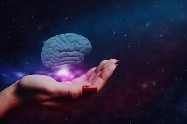 istock Woman holding brain in palm. Mixed media. 1129121294