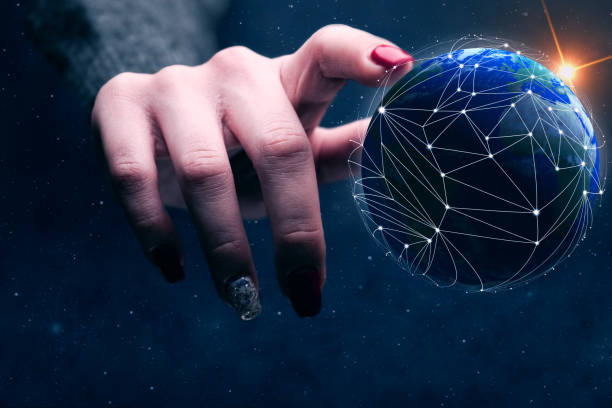 istock Woman touching planet with finger and network web. Mixed media. 1129121386