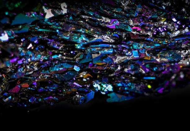 A spilled pouch of genuine gemstones of various colors and minerals.