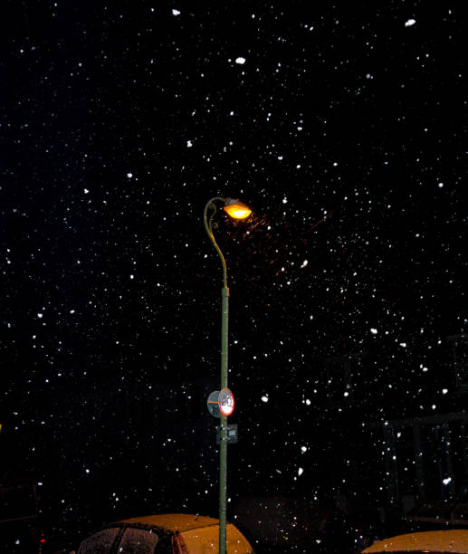 istock Streetlight in falling snow at night 1129122982