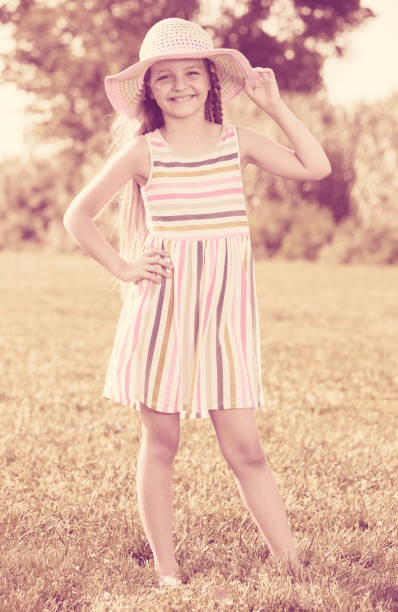 istock girl standing outdoors 1129123002