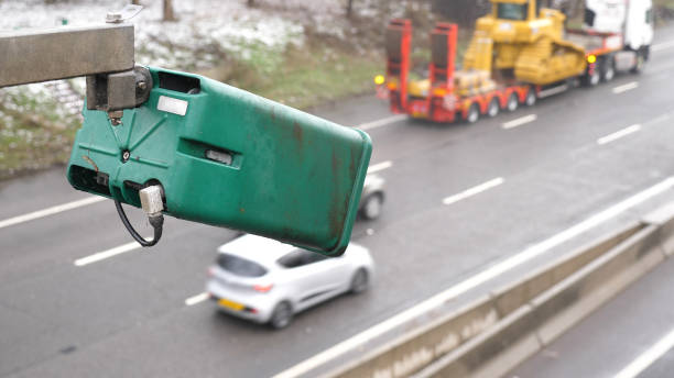 istock winter day view average speed traffic camera under falling snow over UK Motorway 1129123096