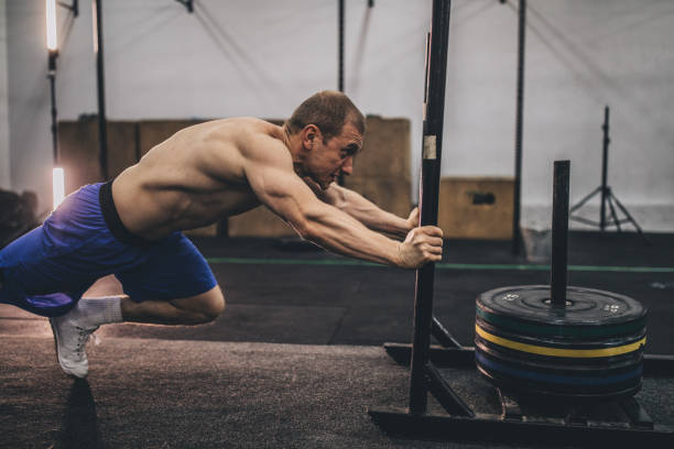 istock Muscular man working out at the gym 1129123958