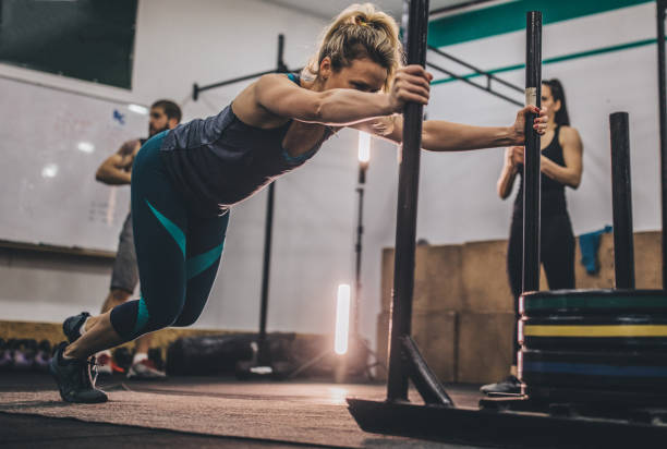 istock Exercising at the gym 1129124700
