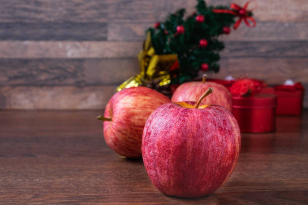 istock Fresh Apple with Gift Box on Christmas Day 1129125362