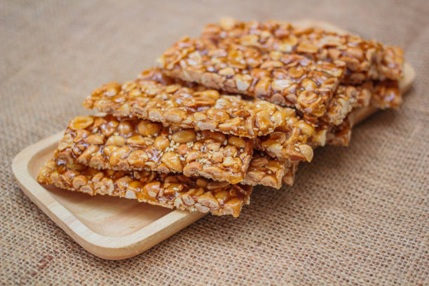 istock Peanut sesame snack, (Tua gra joak) sweet peanuts stick. 1129125532