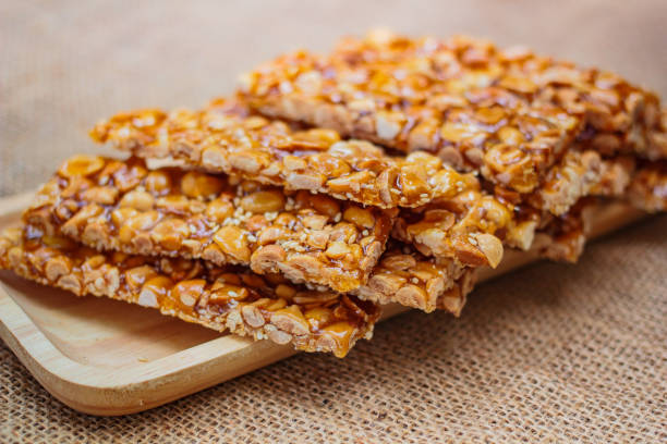 istock Peanut sesame snack, (Tua gra joak) sweet peanuts stick. 1129125638