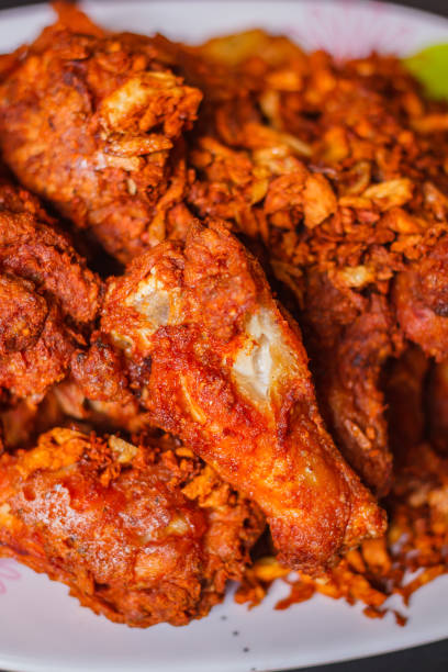 istock Hot and crispy fried chicken legs, thai style. 1129125711