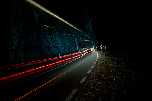 Long exposure image of a car entering the tunnel