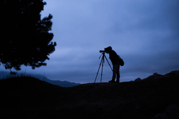 istock Photographer in the dark 1129129362