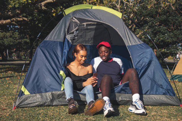 istock Tent and Smart Phone Couple 2 1129130529