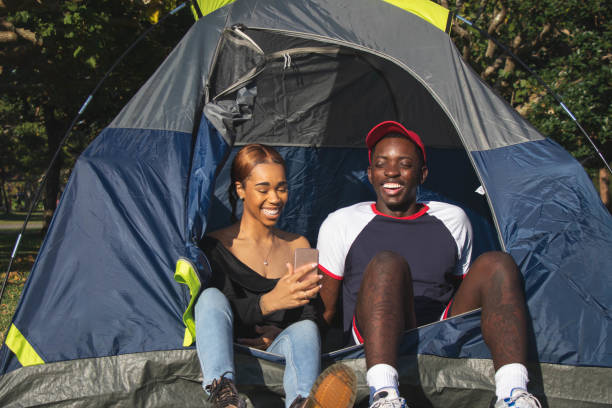 istock Tent and Smart Phone Couple 3 1129130535