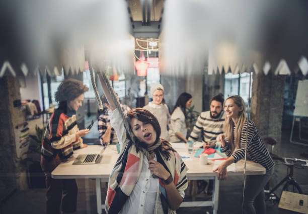 istock This meeting is so boring that I will strangle myself! 1129131038