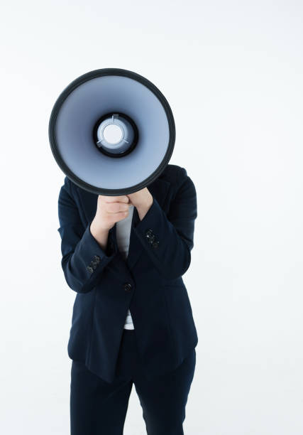 istock Businesswoman shouting with a megaphone 1129137034