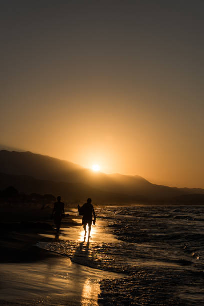 istock A couple walking on the beach 1129138760