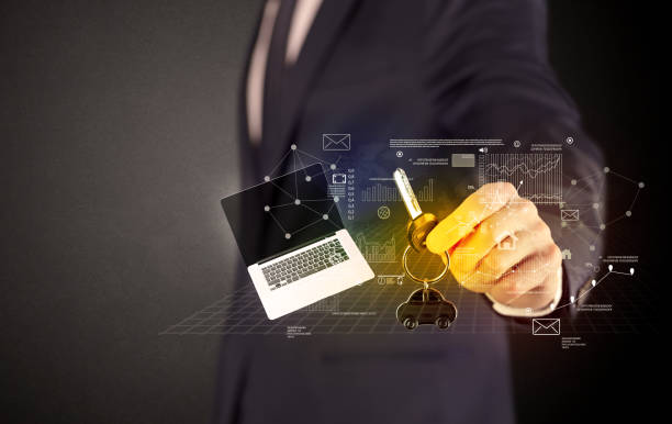 istock Businessman holding keys with graphs around 1129141080