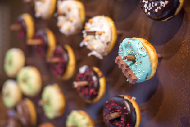 Delicious donuts on wooden stander