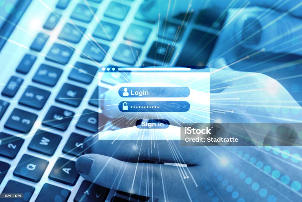 A woman on the computer types in her username and password Internet Stock Photo