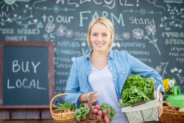 istock Woman Holding Vegetables 1129142055