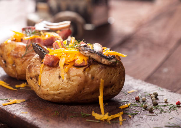 istock Baked stuffed potatoes with bacon, cheddar, mushrooms and dill 1129142886