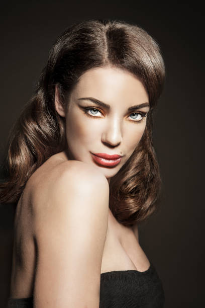 istock Classy Sexy Female Beauty Looking Over Shoulder 1129143072