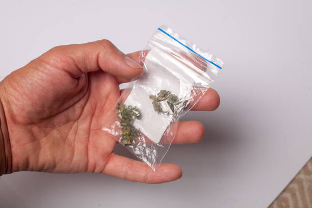 istock hand with pack of marijuana 1129144998