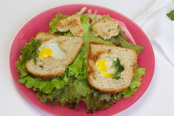 istock Breakfast of sausages, quail eggs, herbs and vegetables. 1129145047