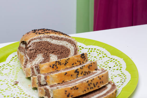 istock Freshly ruddy bread. The slice shows cocoa blotches. 1129145733