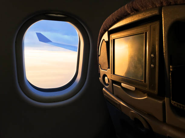 istock Sunlight from the porthole on airplane 1129148351