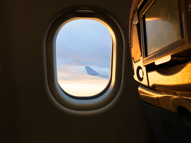 istock Sunlight from the porthole on airplane 1129148429