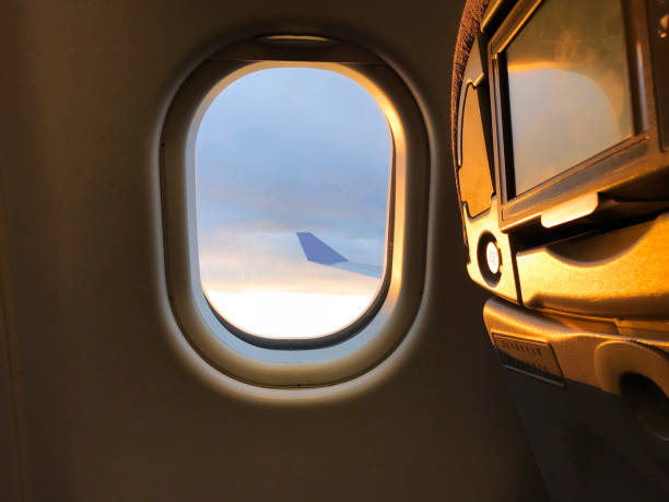 istock Sunlight from the porthole on airplane 1129148635