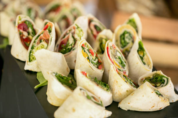 istock Delicious wrap with salad and bacon on table 1129149165