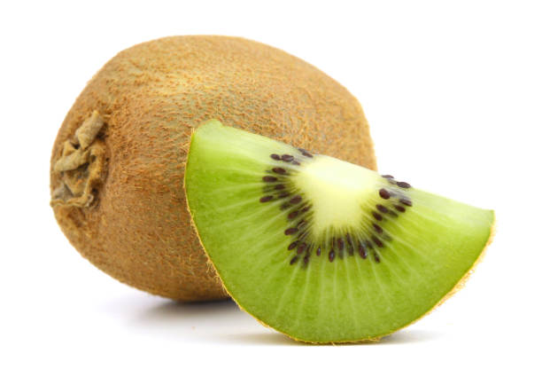 istock Kiwi fruit sliced segments isolated on white background 1129149220