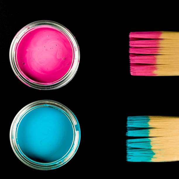istock Pink and Blue Paint Pots With Paint Brushes 1129149410