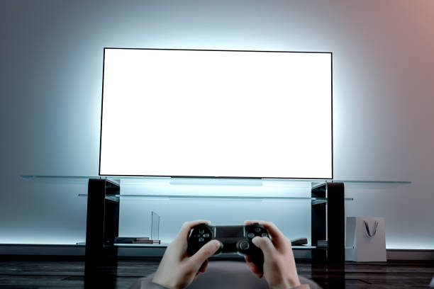 Playing videogame with joystick near blank white tv screen mockup
