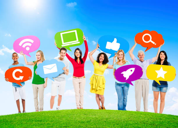 istock Diverse Multi-Ethnic People Outdoors Holding Social Network Related Speech Bubbles 1129150411
