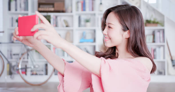 istock Young asian woman take selfie 1129150426