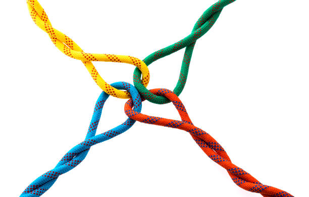 istock Colored ropes tied on white background 1129150479