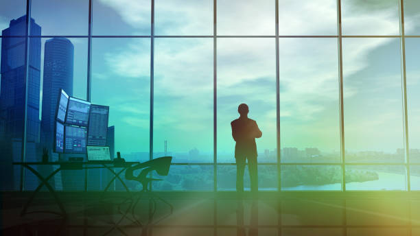 istock Silhouette of a trader in the office before infographics 1129150507